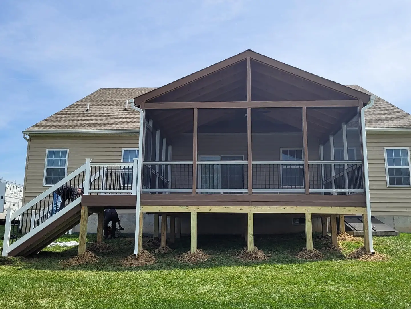 Screened-in porch with composite decking and vaulted roof built by Prodecks in Delaware
