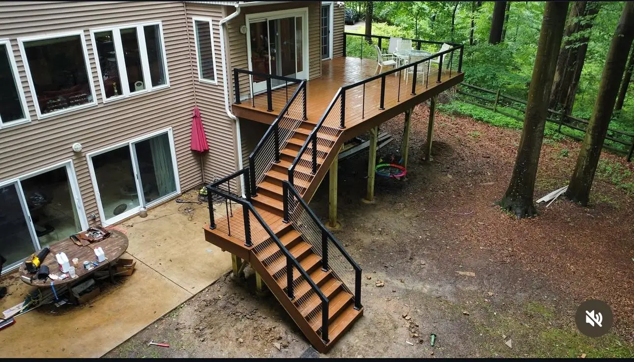 ProDecks elevated deck with cable railing — a beautiful fence and deck combination